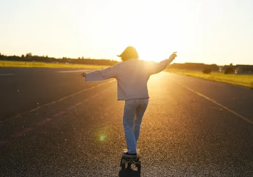 teen-girl-feeling-happy-longboard-happy-young-skater-riding-her-skateboard-with-hands-spread-opt teen-girl-feeling-happy-longboard-happy-young-skater-riding-her-skateboard-with-hands-spread-opt